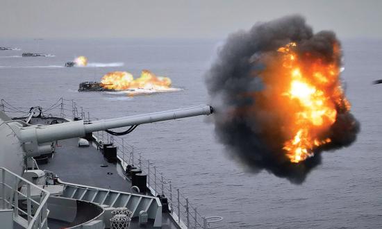 A Chinese destroyer and amphibious assault vehicles fire on Taiwan in the opening assault of the War of 2026. 