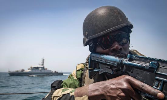 A Senegalese sailor participates in a visit, board, search and seizure training scenario aboard the Gambian navy GNS Kuntah Kinteh during Exercise Obangame Express 2019