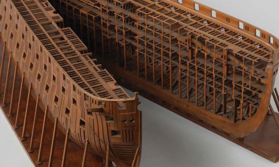 A construction model of a ship-of-the-line that shows many of Seppings’ innovations: Seppings blocks and shoring beneath, diagonal bracing in the upper level of the bow, and a rounded bow and stern.