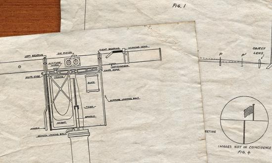 A drawing of an early Barr and Stroud rangefinder that shows the device’s principal components. The paired eyepieces are near the top in the center.