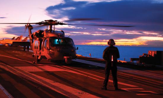 An MH-60S Knighthawk multimission helicopter spins up on the flight deck of the USS George Washington (CVN-73). To make space on crowded carrier flight decks, MH-60S numbers were decreased to five in each air wing, and MH-60Rs were decreased to ten.  Because of how they are distributed, this change could result in as much as a 50 percent reduction in rotary-wing aircraft on board carriers.