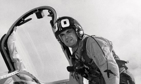 Captain Frank Ault climbing out of a cockput