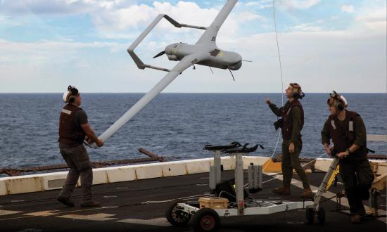 Marines with Marine Medium Tiltrotor Squadron 365 Reinforced lower an RQ-21A Blackjack unmanned aerial surveillance aircraft down from the STUAS recovery system using the vertical capture rope as the 24th Marine Expeditionary Unit and USS Mesa Verde (LPD-19).