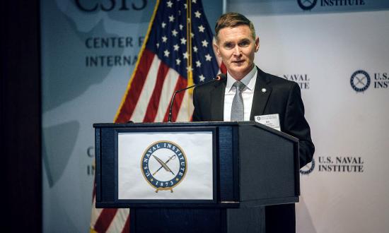 Proceedings Editor-in-Chief Bill Hamblet standing at a podium