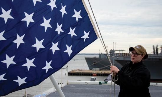 C&D-PRO-4-19 1  Quartermaster 2nd Class Taylor Miller, from Kent, Ohio, unfurls the union jack on the jack staff of the aircraft carrier USS Dwight D. Eisenhower (CVN-69) on February 19, 2019.