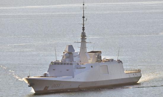 Aerial port bow view of the French frigate Bretagne underway at sea