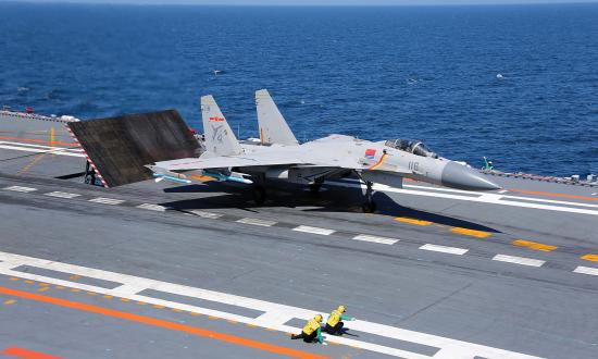 A J-15 Flying Shark fighter prepares for launch from the Liaoning.