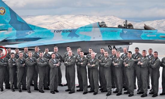 TOPGUN aviators posing in front of an F-16N fighter