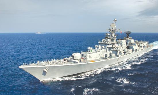 Port bow view of INS Delhi underway at sea.