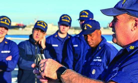 A U.S. Coast Guardsman instructs personnel on the USCGC Stone (WMSL-758) in 2023. Beyond providing feedback, leaders should consider asking intrusive questions to better know their people.