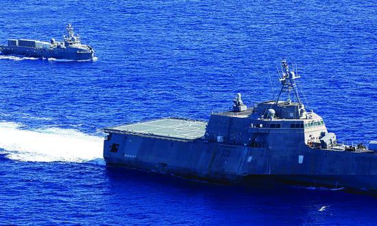 The USS Gabrielle Giffords (LCS-10) sails with the unmanned surface vessel Ranger in the Pacific Ocean in September 2023. 