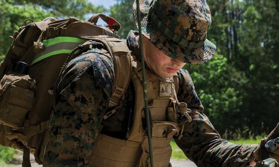 A U.S. Marine with 2nd Marine Logistics Group programs an AN/PRC-117F radio at Battle Skills Training School on Cape Lejeune, North Carolina.