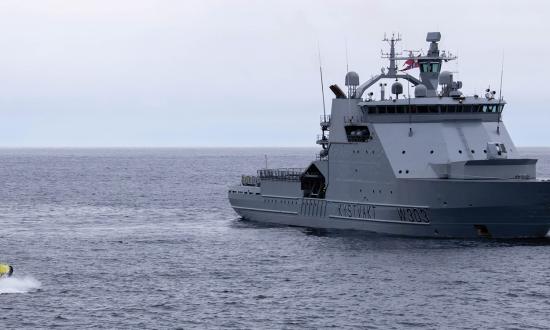 A boat from the Norwegian Coast Guard vessel Svalbard delivers crew members from the USCGC Healy (WAGB-20) as part of a crew exchange. The Norwegian Coast Guard—which has no shortage of afloat officers—dual crews its ships following a predictable schedule. The U.S. Coast Guard should take note.