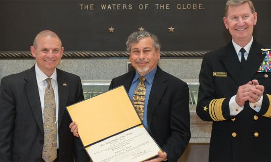 Dr. Richard Abels (right), with then–Naval Academy Academic Dean and Provost Andrew Phillips, was recognized as professor emeritus in 2018, after 35 years teaching history at the Academy.