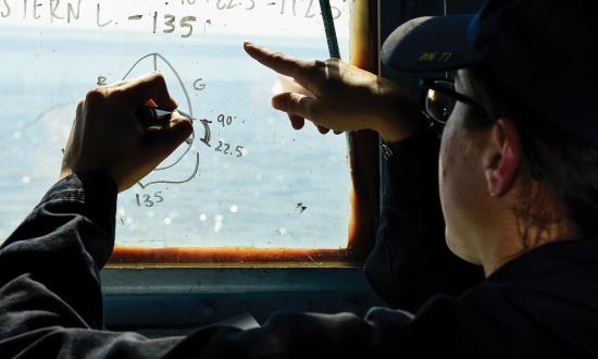 Navy ensign conducts rules of the road training.