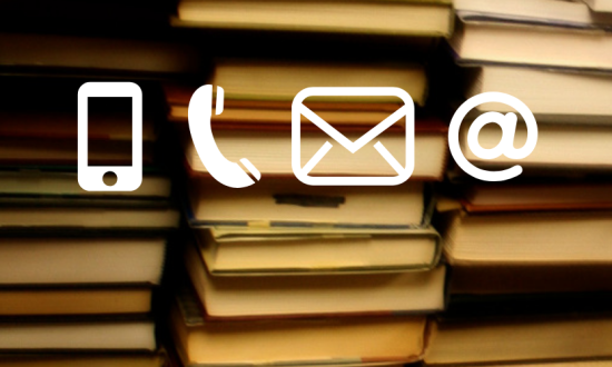 White contact icons of cell phone, telephone receiver, envelope and @ sign on a background of book stacks.