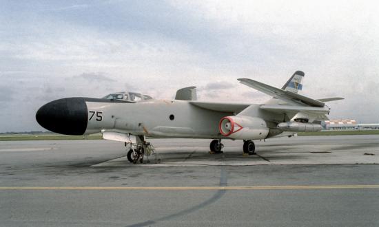 NRA-3B Skywarrior aircraft equipped with electronic warfare (jammer) pods, with its wing folded up at the Pacific Missile Test Center.