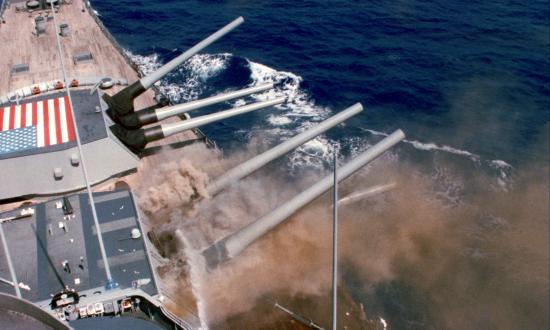 A photo taken from the bridge captures the explosion of the No. 2 16-inch gun turret aboard the battleship USS Iowa (BB-61)