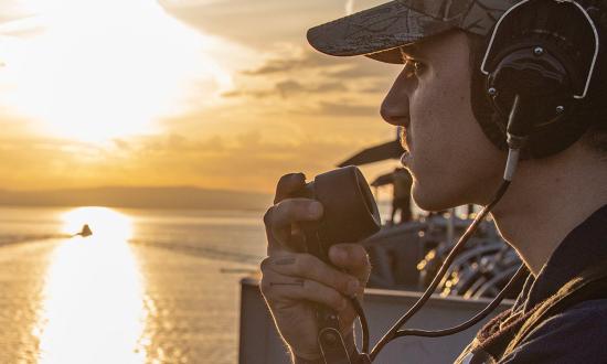 A sailor stands watch on the USS George H. W. Bush (CVN-77) in November 2022.  Ask any sailor who has been underway, and it will not be hard to find something all deployed ships are short of: Sleep.