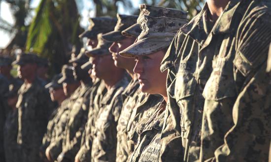 eabees assigned to  Naval Mobile Construction Battalion (NMCB) 1 stand in formation at Veterans Memorial Park during the 31st Marine Expeditionary Unit (MEU) and Combat Logistics Battalion 31 243rd Marine Corps Birthday ceremony on Tinian, Commonwealth of the Northern Mariana Islands, Nov. 10, 2018