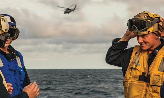 Sailors on the flight deck of the USS Paul Ignatius (DDG-117)