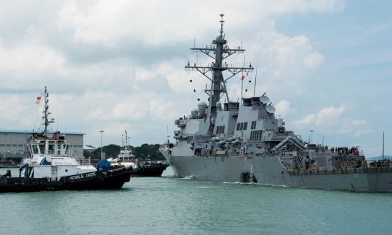 Tugboats assist the USS John S. McCain (DDG-56) 