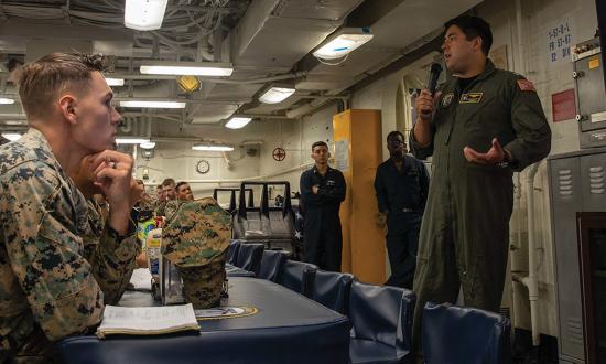 The safety officer on board the USS Makin Island (LHD-8) discusses safety with Marines assigned to the 13th Marine Expeditionary Unit. The Navy needs to implement changes to safeguard its most important assets—sailors and Marines.