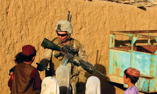  Marine speaking with local villagers