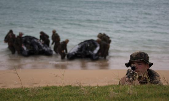 Marines from the 31st Marine Expeditionary Unit on board the USS Ashland (LSD-48) secure a beach on Okinawa during a 2019 exercise.