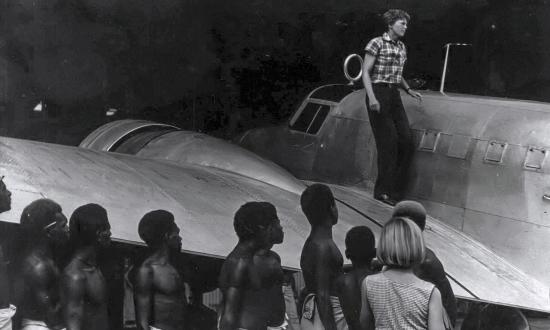 Amelia Earhart dismounting her Lockheed Electra on Lea