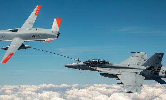 Super Hornet refuels with an MQ-25 Stingray