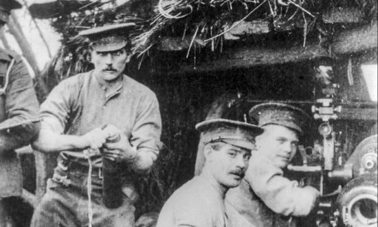 British troops load their gun in a camouflaged bunker circa April 1915