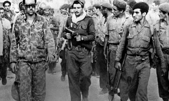 Cuban troops lead away a captive CIA officer (left) after the disastrous amphibious landing attempt at the Bay of Pigs.  The decision to hold off on air support, and the failure to make fuller use of the offshore U.S. fleet, sealed the undertaking’s doom.