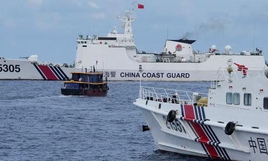 China Coast Guard ships block a Philippine supply boat the near Second Thomas Shoal in the South China Sea. Initiatives like Project Myoushu help counter China’s gray zone tactics. 