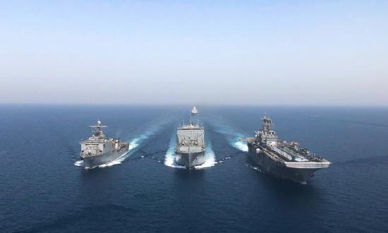  The amphibious dock landing ship USS Oak Hill (LSD-51), left, the dry cargo and ammunition ship USS Robert E. Peary (T-AKE-5), and amphibious assault ship ISS Bataan (LHD-5) execute a replenishment at sea in the Arabian Gulf this past April.