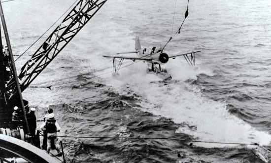 The USS Stevens (DD-479) tests the ship’s aircraft recovery system.