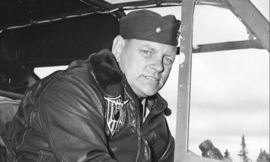 Lt. Cmdr. Frank Erickson seated at the controls of an HNS-1.