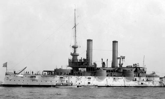 Shown in her early configuration in a circa 1900 photograph, the Iowa (Battleship No. 4) wears a white and buff paint scheme. Of interest is that while the border between the two colors is at the forecastle deck level, the aft main turret, on the main deck one level lower, is painted in both colors.  