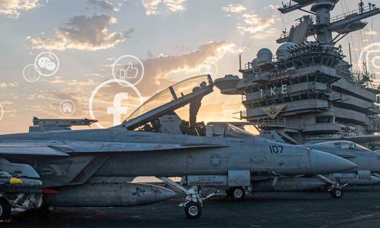 An aviation structural mechanic (equipment) cleans an F/A-18F Super Hornet canopy on board the aircraft carrier USS Dwight D. Eisenhower (CVN-69) in the Red Sea in April 2024.