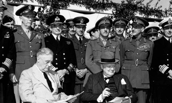 January 1943: U.S. President Franklin Roosevelt (seated left) and British Prime Minister Winston Churchill (seated right) gather with their Combined Chiefs of Staff in Morocco for the Casablanca Conference. (Standing, left to right: Admiral Ernest J. King, USN; General George C. Marshall USA; Admiral Sir Dudley Pound, Air Chief Marshal Sir Charles Portal, General Sir Alan Brooke, Field Marshal Sir John Dill, Admiral Lord Louis Mountbatten.)