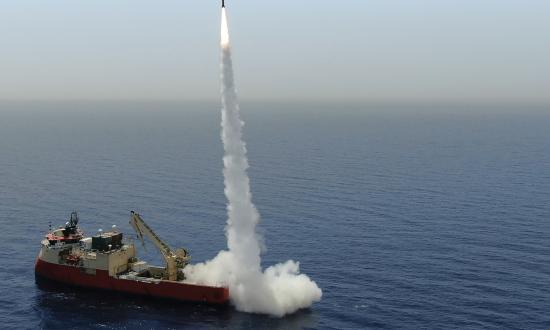 An IAI LORA missile is test-fired from a cargo ship.