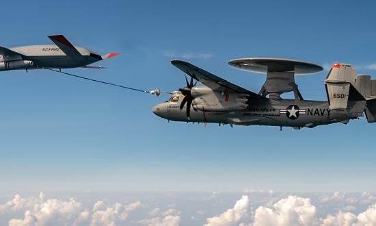 A MQ-25 Stingray refuels a E-2D Advanced Hawkeye.