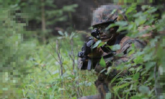 U.S. Navy Corpsman posts security during a patrolling exercise at Joint Base Elmendorf-Richardson, Anchorage, Alaska