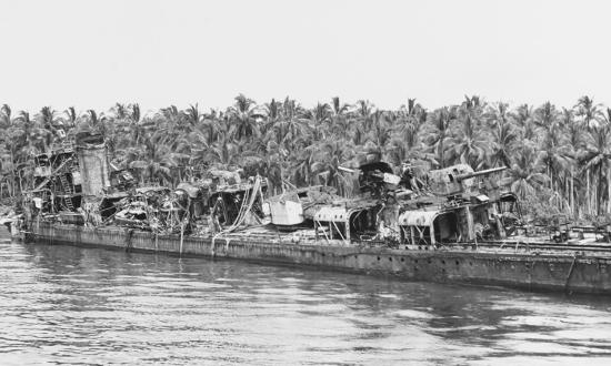 The Imperial Japanese destroyer Nagatsuki aground off Bambari Harbor after being battered by U.S. airstrikes.