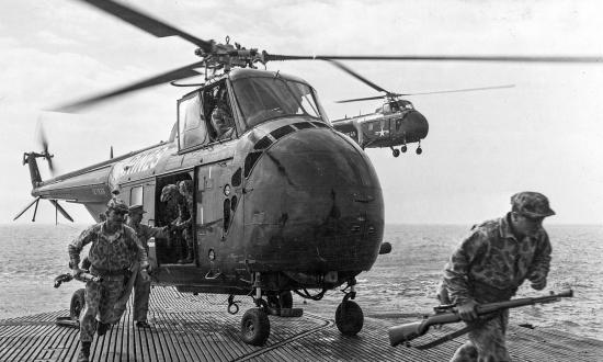 Marines from the Reconnaissance Company, 2d Marine Division, disembark from an HRS-1 on board the submarine Sea Lion (ASSP-315)