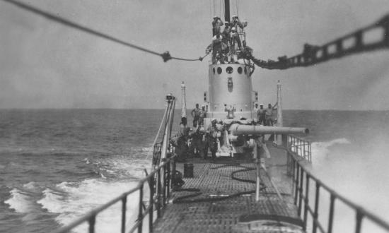 A U.S. Navy submarine firing its gun in the 1930s.