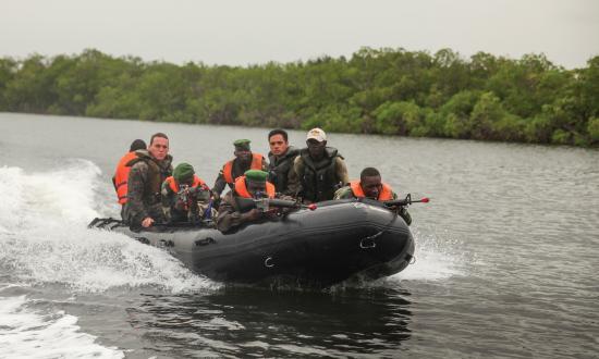 Part of a security cooperation team, U.S. Marines conduct a small boat formation exercise with their counterparts in Senegal. A Navy command modeled on the Marine Corps Security Cooperation Group could formally coordinate security cooperation activities to improve U.S. interoperability with allied navies.