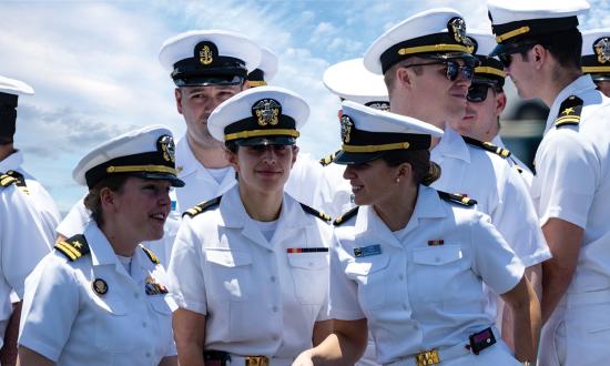 Officers assigned to the fast-attack submarine USS North Carolina (SSN-777) gather topside on the boat’s return to Joint Base Pearl Harbor–Hickam following an extended Indo-Pacific deployment.