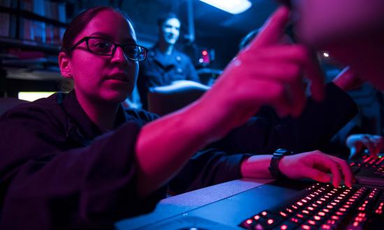 Cryptologic Technician (Collection) 3rd Class Ambar Morales-Diaz analyzes data aboard the aircraft carrier USS Theodore Roosevelt (CVN-71)