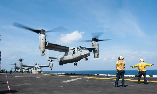 An MV-22 Osprey assigned to Marine Medium Tiltrotor Squadron (VMM) 161 (Reinforced) aboard the amphibious assault ship USS America (LHA 6) lifts off from the flight deck during routine flight operations.